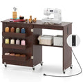 Giantex Folding Sewing Table with Storage, 3 Side Trays & Open Shelf, Built-in Charging Station, Mobile Craft Desk with Lockable Wheels, Space-Saving Sewing Machine Table for Home, Dorms, Espresso - color: Espresso